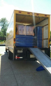 picture of home furnishings wraped and loaded on moving truck